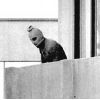 Terrorist at balcony of Olympic village during the abduction.